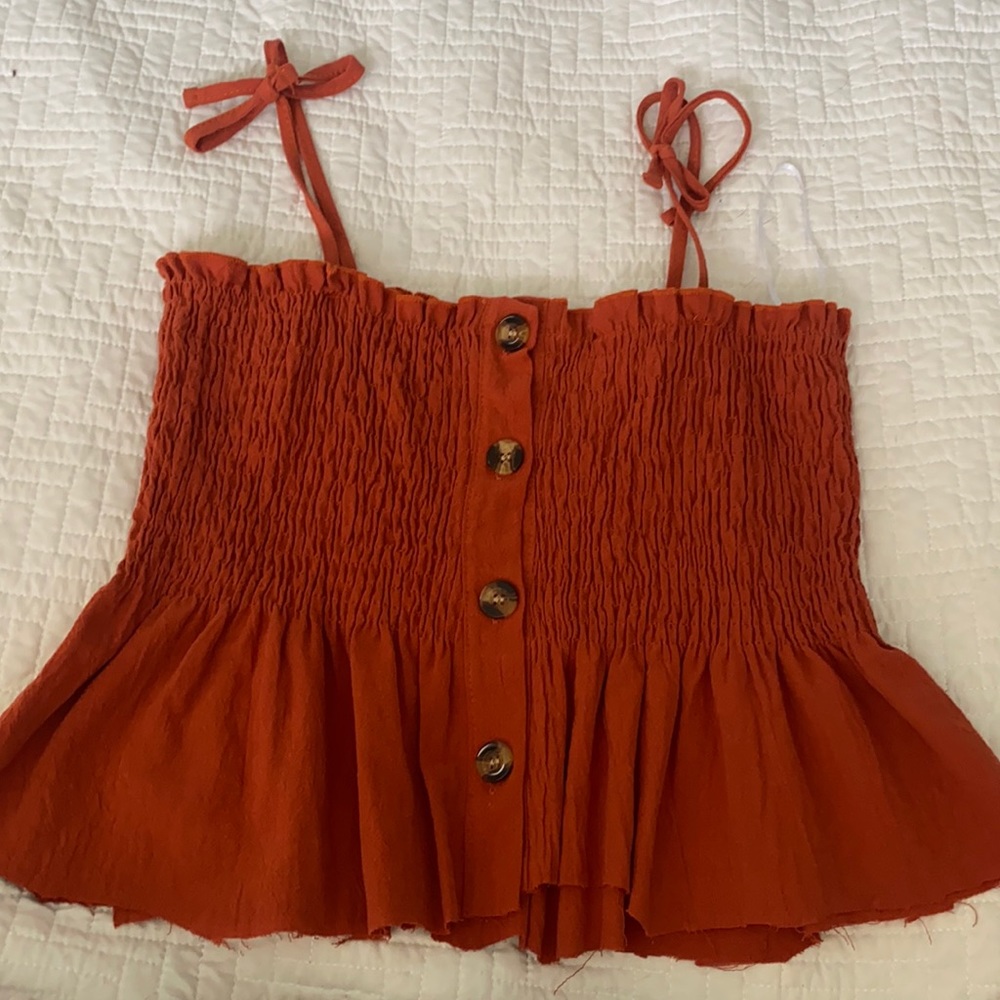 Orange/red tank top. Size small.